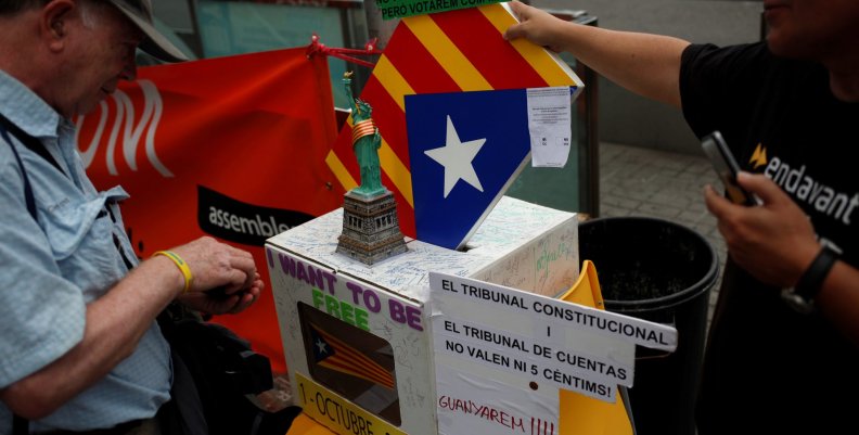 ANC member and public worker of the Terrasa's town hall, Pep Rovira, talks to a man during a protest in favor of the banned October 1 independence referendum in Barcelona ANC member and public worker of the Terrasa's town hall, Pep Rovira, talks to a man during a protest in favor of the banned October 1 independence referendum in Barcelona