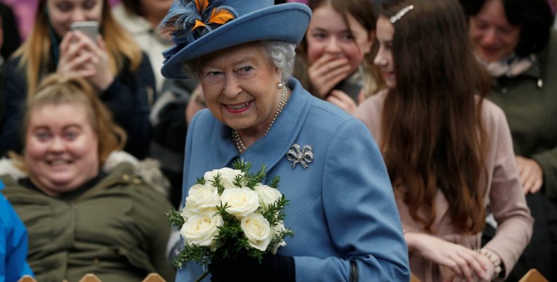 Britain's Queen Elizabeth is greeted by local people as she arrives at the railway station in Kingston upon Hull for a visit to mark its year as the United Kingdom's City of Culture