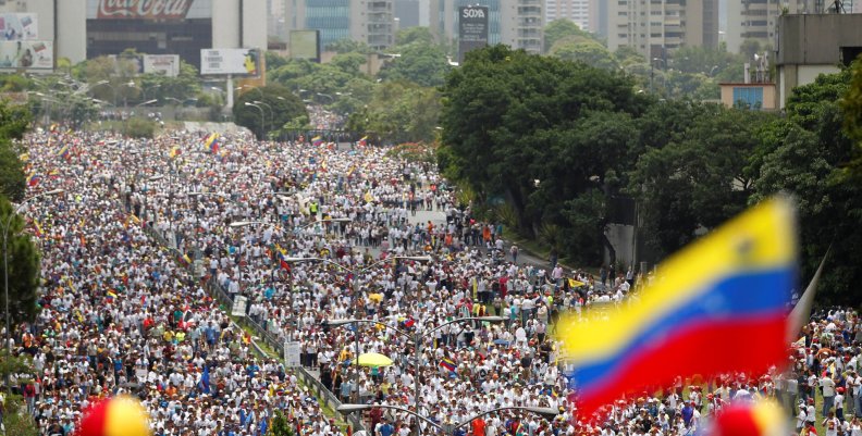 Demonstrators clash with riot police during the so-called "mother of all marches" against Venezuela's President Maduro in Caracas Demonstrators clash with riot police during the so-called "mother of all marches" against Venezuela's President Maduro in Caracas