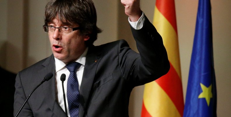 Former Catalan leader Carles Puigdemont gestures during a meeting with Catalan mayors in Brussels Former Catalan leader Carles Puigdemont gestures during a meeting with Catalan mayors in Brussels