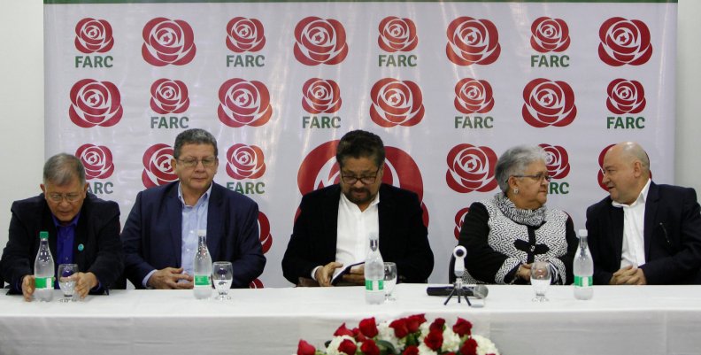Members of the political party of the FARC look on during the presentation of their candidates in Bogota Members of the political party of the FARC look on during the presentation of their candidates in Bogota