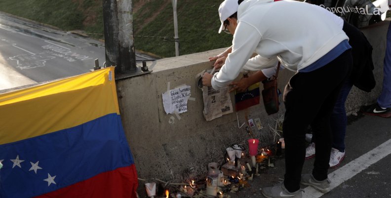 Opposition supporters attend a candlelight rally to pay tribute to victims of violence during protests against Venezuelan President Nicolas Maduro's government in Caracas Opposition supporters attend a candlelight rally to pay tribute to victims of violence during protests against Venezuelan President Nicolas Maduro's government in Caracas