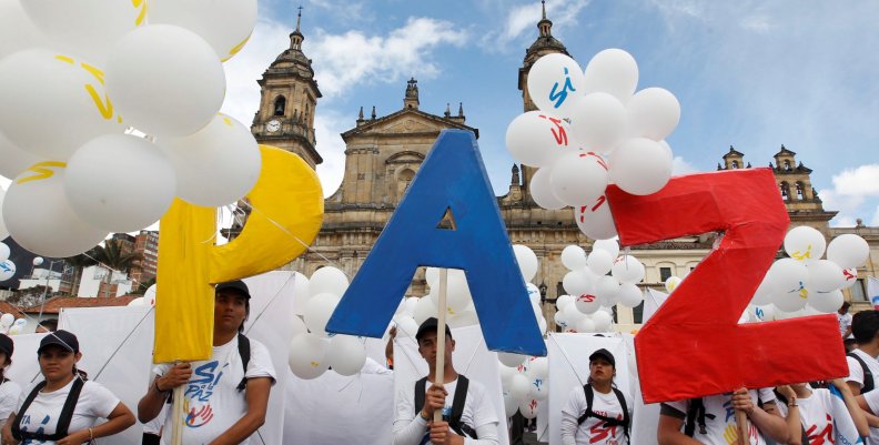 People form the word Peace with letters at the Bolivar square outside the cathedral in Bogota People form the word Peace with letters at the Bolivar square outside the cathedral in Bogota