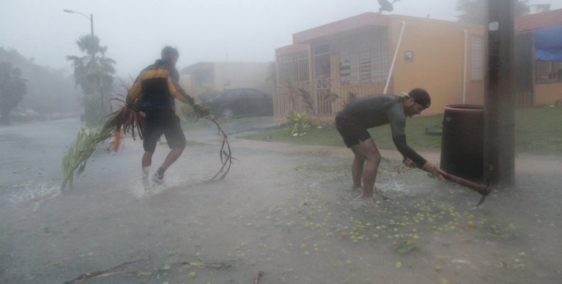 People pick up debris as Hurricane Irma howled past Puerto Rico after thrashing several smaller Caribbean islands, in Fajardo People pick up debris as Hurricane Irma howled past Puerto Rico after thrashing several smaller Caribbean islands, in Fajardo