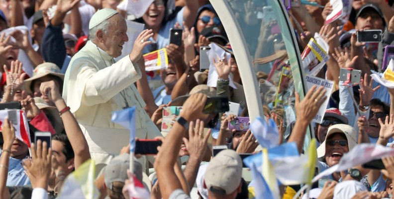 Pope Francis waves as he arrives to celebrate a mass at Huanchaco beach in Trujillo Pope Francis waves as he arrives to celebrate a mass at Huanchaco beach in Trujillo