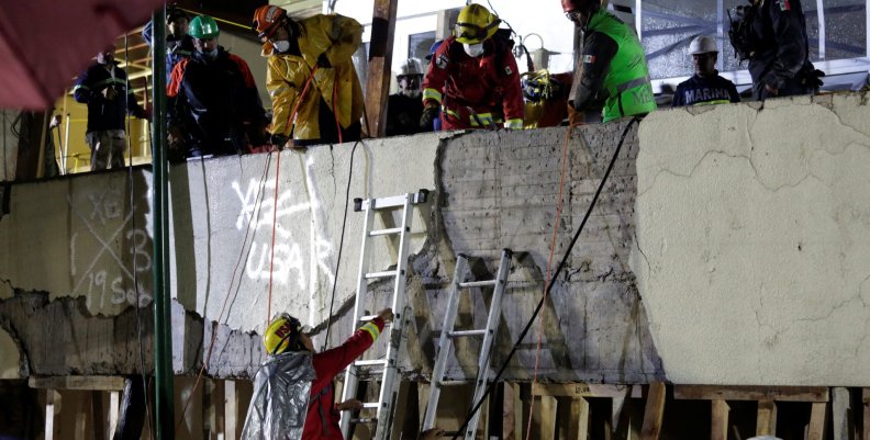 Rescue workers are seen during a search for students at the Enrique Rebsamen school after an earthquake in Mexico City Rescue workers are seen during a search for students at the Enrique Rebsamen school after an earthquake in Mexico City