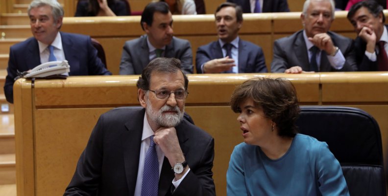 Spain's PM Rajoy listens to Deputy PM Saenz de Santamaria at the start of a debate at the upper house Senate in Madrid Spain's PM Rajoy listens to Deputy PM Saenz de Santamaria at the start of a debate at the upper house Senate in Madrid