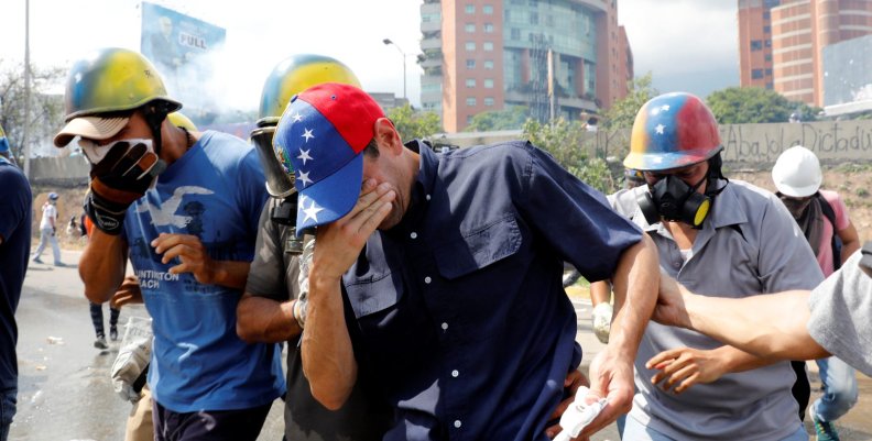 Venezuela opposition leader and Governor of Miranda state Capriles reacts as he is affected by tear gas while rallying against Venezuela's President Maduro in Caracas Venezuela opposition leader and Governor of Miranda state Capriles reacts as he is affected by tear gas while rallying against Venezuela's President Maduro in Caracas