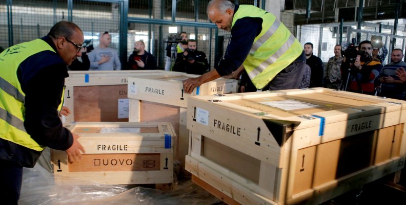 Workers unload boxes of artefacts at Beirut's International Airport Workers unload boxes of artefacts at Beirut's International Airport