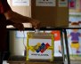A man casts his vote in a polling station during a nationwide election for new governors in Caracas