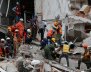Mexican soldiers and rescue workers work on a collapsed building after an earthquake in Mexico City