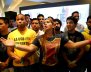 Opposition supporters react while listening to the results of the nationwide election for new governors in Caracas
