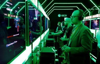 A man tests the new Microsoft Xbox One during the world's largest computer games fair Gamescom in Cologne