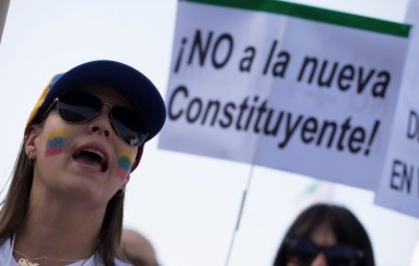 A woman shouts slogans during a protest held by Venezuelan's in Spain against Venezuela's Constituent Assembly election in Madrid