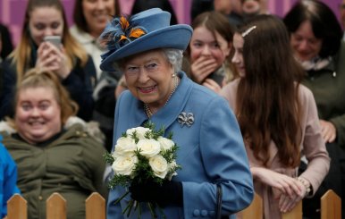Britain's Queen Elizabeth is greeted by local people as she arrives at the railway station in Kingston upon Hull for a visit to mark its year as the United Kingdom's City of Culture