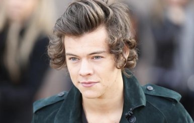 British singer Harry Styles from the band One Direction arrives to attend the presentation of the Burberry Autumn/Winter 2014 collection during London Fashion Week