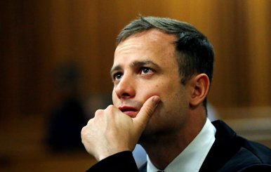 FILE PHOTO: Olympic and Paralympic track star Oscar Pistorius looks on ahead of his sentencing hearing in Pretoria
