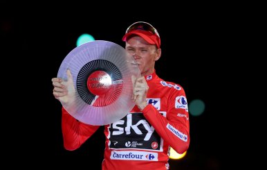 FILE PHOTO: Team Sky rider Froome of Britain celebrates on the podium after winning the Vuelta Tour of Spain after the last stage of the cycling race between Arroyomolinos and Madrid