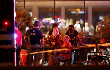 People wait in a medical staging area on October 2, 2017, after a mass shooting at a music festival in Las Vegas
