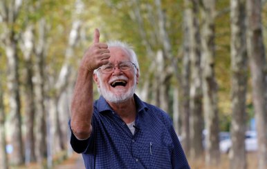 Scientist Jacques Dubochet poses after the news conference after winning the 2017 Nobel Prize in Chemistry, at the University of Lausanne in Lausanne