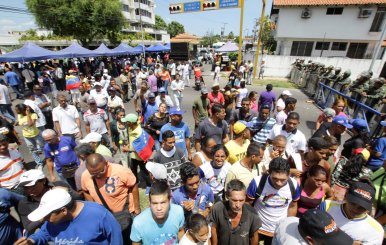 Supporters of Andres Velasquez, the candidate of the MUD for the Bolivar state governor office, attend a gathering near the regional office of the National Electoral Council, in Ciudad Bolivar