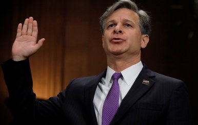 Wray is sworn in prior to testifying before Senate Judiciary Committee confirmation hearing on Capitol Hill in Washington